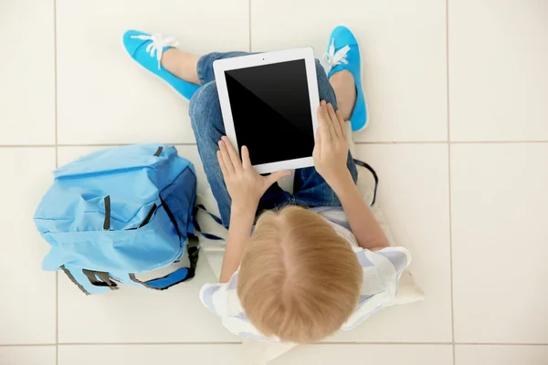 Schoolgirl with tablet, top view — Stock Photo, Image