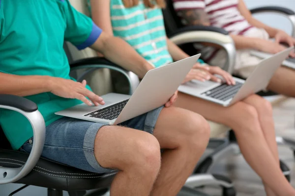 Young people with laptops — Stock Photo, Image
