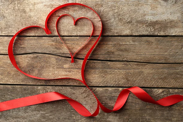 Two hearts made of red ribbon — Stock Photo, Image