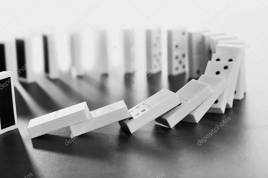 depositphotos_121640774-stock-photo-dominoes-falling-on-gray.jpg