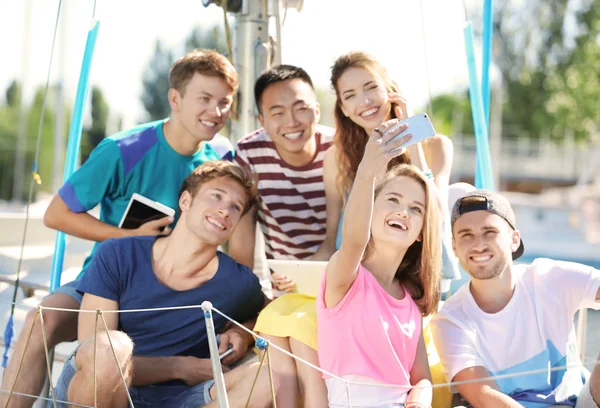 Young people with gadgets — Stock Photo, Image