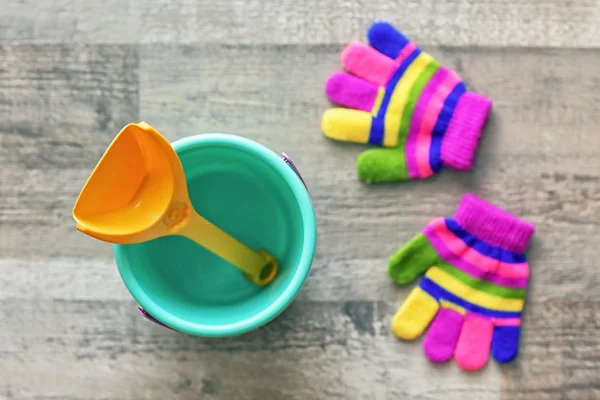 Children bucket, shovel and gloves — Stock Photo, Image