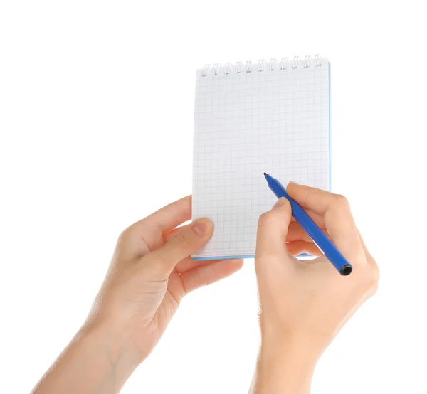 Hand holding notepad and pen Stock Picture