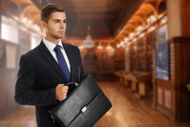 Businessman holding briefcase  clipart