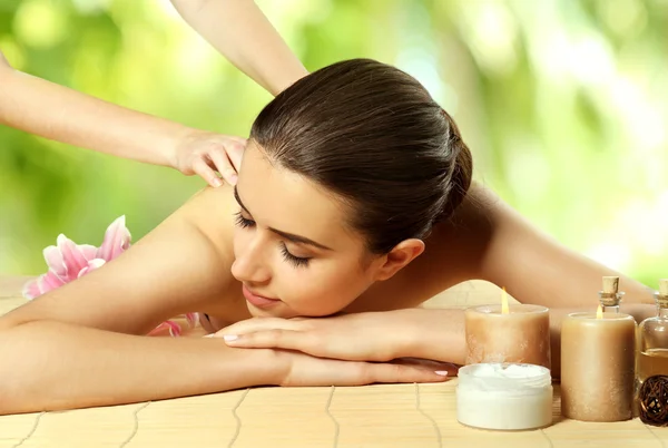 Spa Concept Beautiful Woman Having Massage Table Blurred Green Leaves — Stock Photo, Image