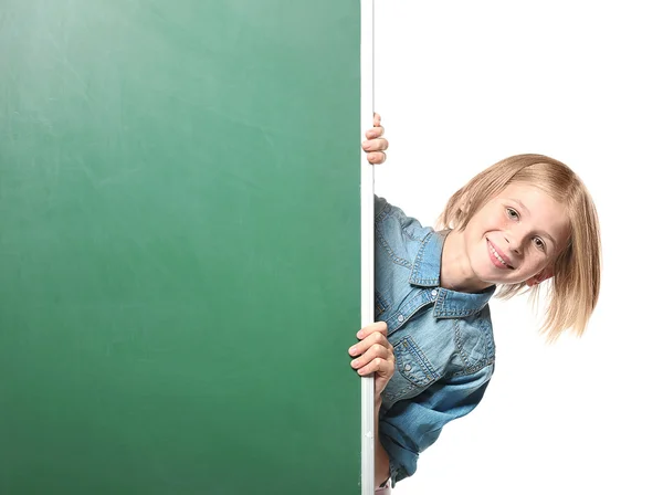 Cute girl near chalkboard — Stock Photo, Image