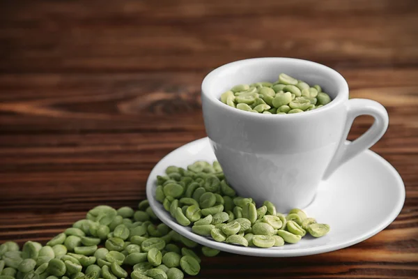 Tazza di caffè con grani — Foto Stock