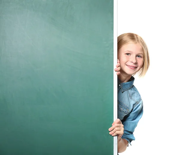 Cute girl near chalkboard — Stock Photo, Image