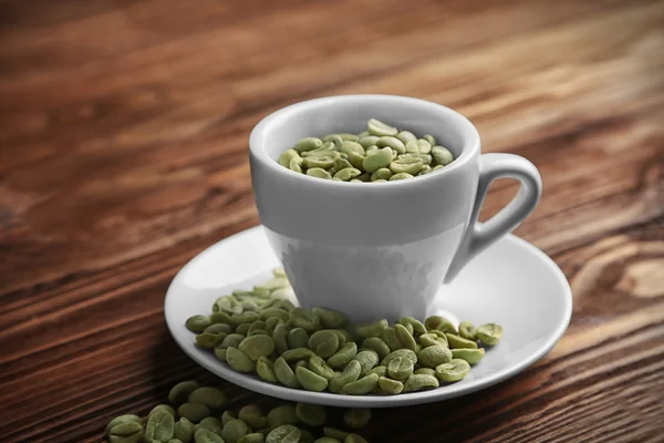 Xícara de café com grãos — Fotografia de Stock