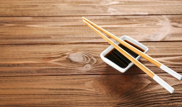 Soy sauce and chopsticks — Stock Photo, Image