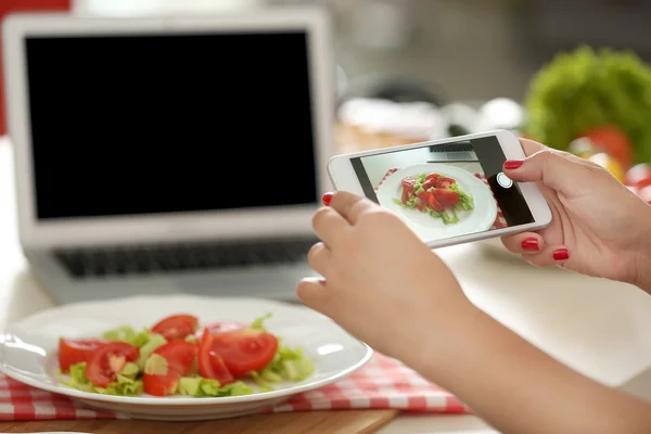 Girl photographing her food — Stock Photo, Image