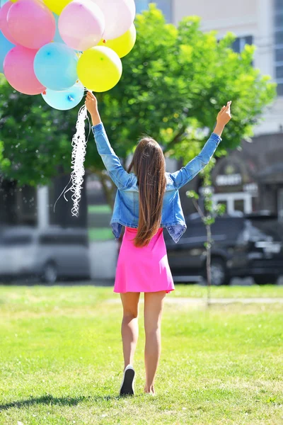 Beautiful girl with balloons — Stock Photo, Image