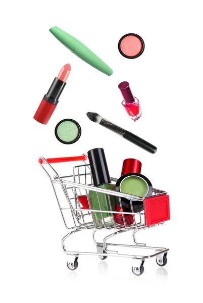 Cart with flying out cosmetics — Stock Photo, Image