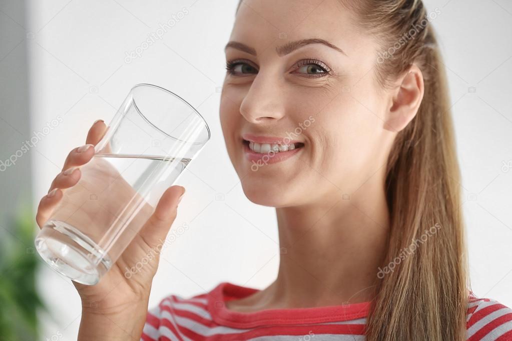 Beautiful girl drinking water 