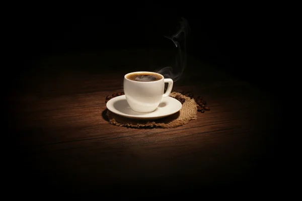 Cup of coffee with beans — Stock Photo, Image