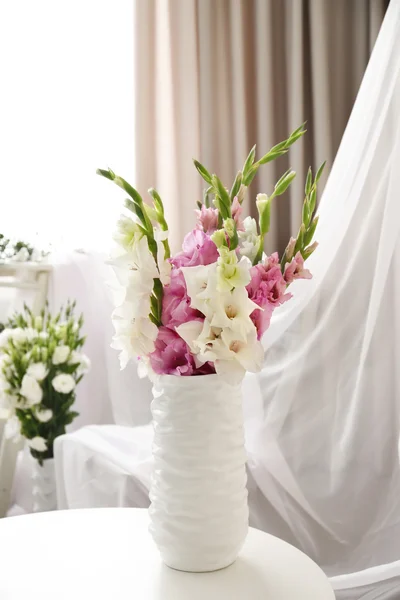 Bouquets of flowers in vases — Stock Photo, Image