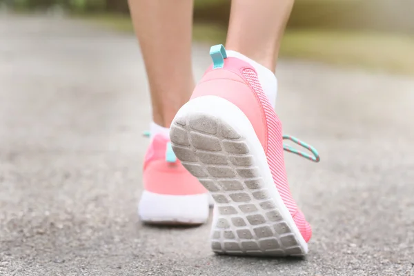 Woman wearing pink sneakers