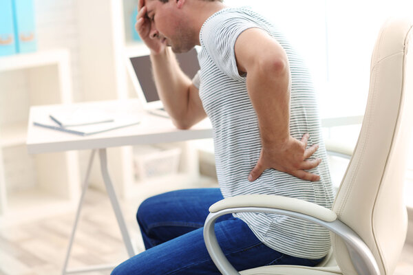 Man suffering from back pain