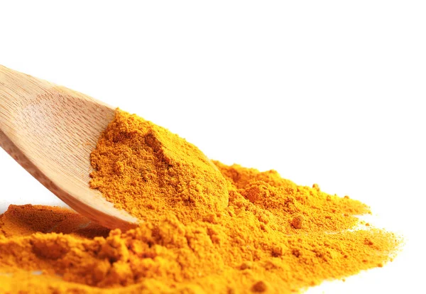 Turmeric powder and wooden spoon — Stock Photo, Image