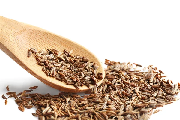 Cumin seeds and wooden spoon — Stock Photo, Image