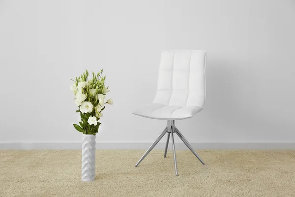 Chair and decorative flowers — Stock Photo, Image