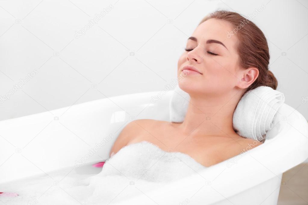 girl relaxing in bathtub   