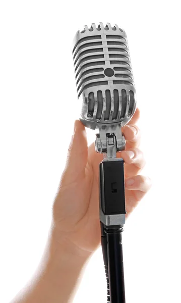 Mão feminina com microfone vintage — Fotografia de Stock