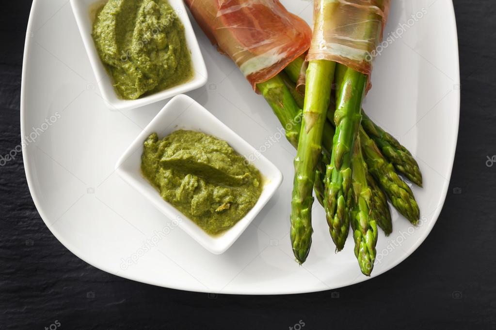 Asparagus with bacon on plate