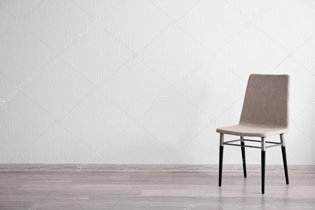 Grey chair in light room