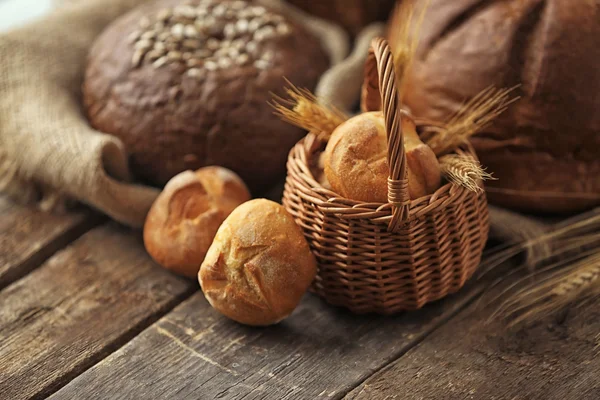 Basket with bread buns and spikes — Stock Photo, Image