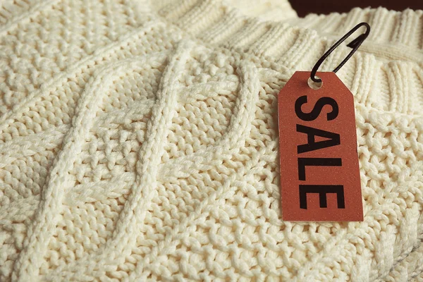 Sale label on sweater — Stock Photo, Image