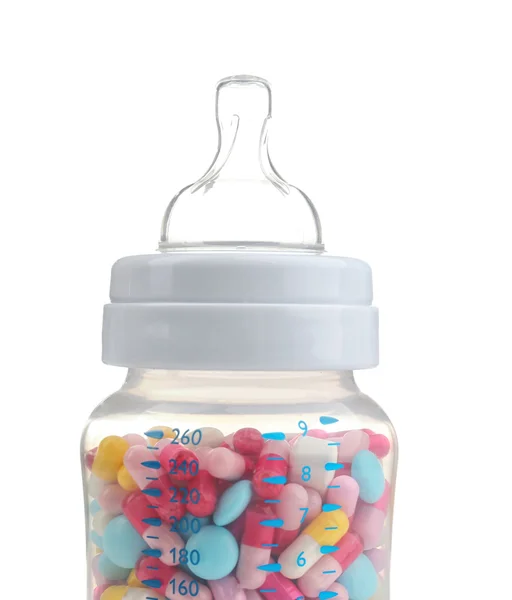 Bottiglia per bambini piena di pillole — Foto Stock