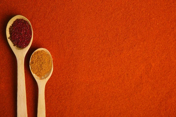 Spices in wooden spoons — Stock Photo, Image