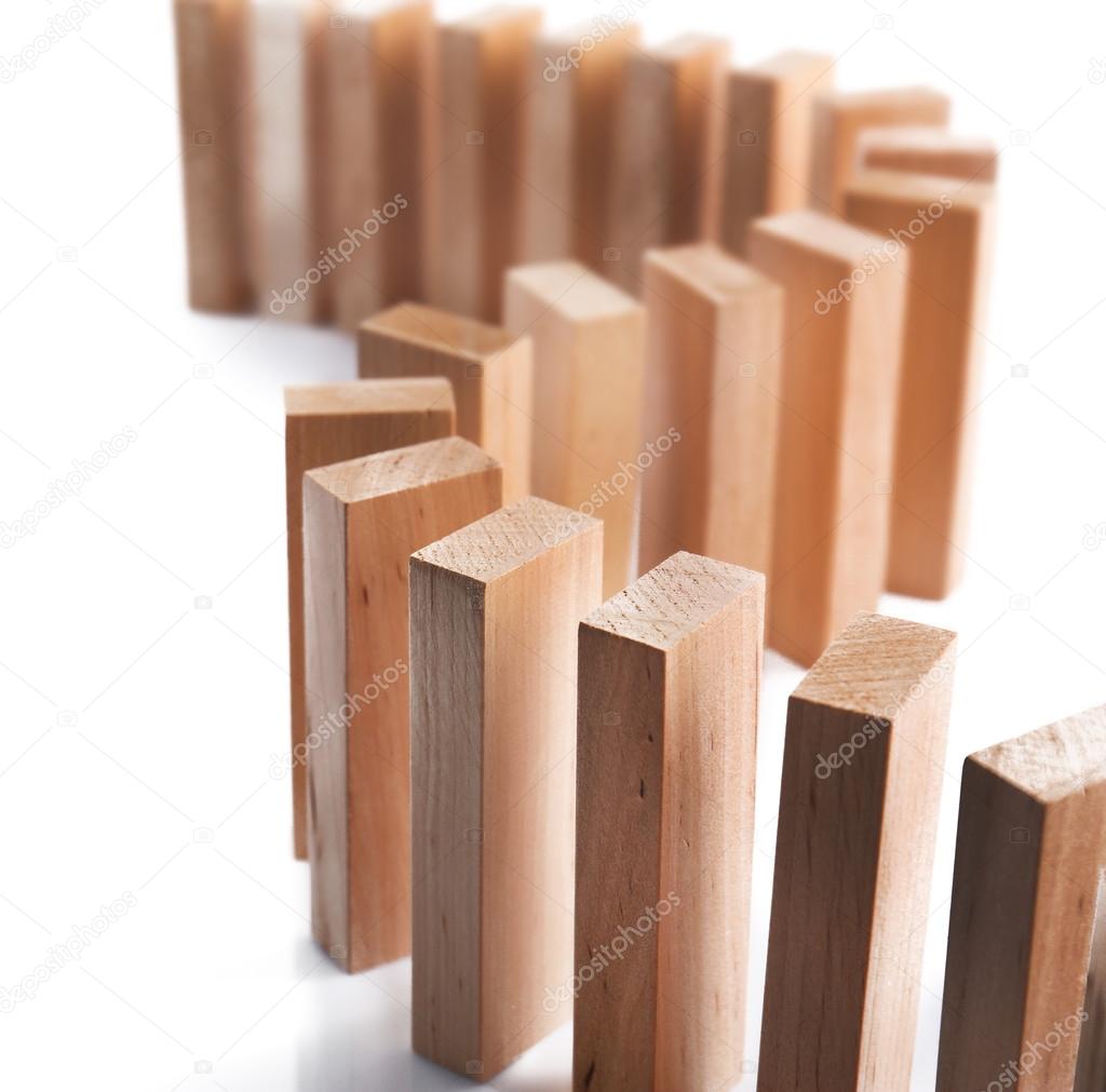 Wooden dominoes on light background