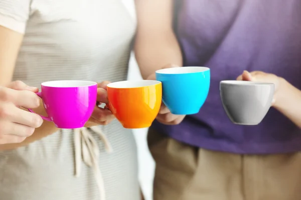 Holding cups of coffee — Stock Photo, Image