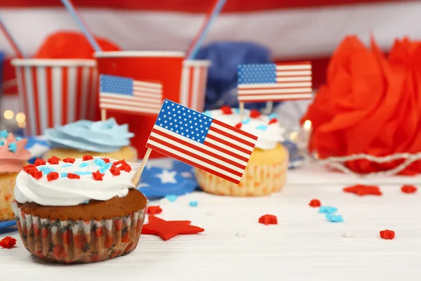 Delicious cupcake on white wooden table — Stock Photo, Image