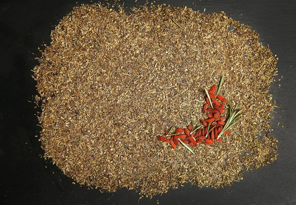 Rosemary and goji berries on spices background — Stock fotografie