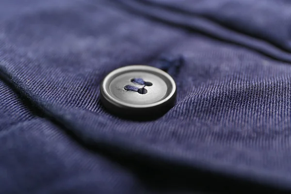 Grey button on clothes — Stock Photo, Image