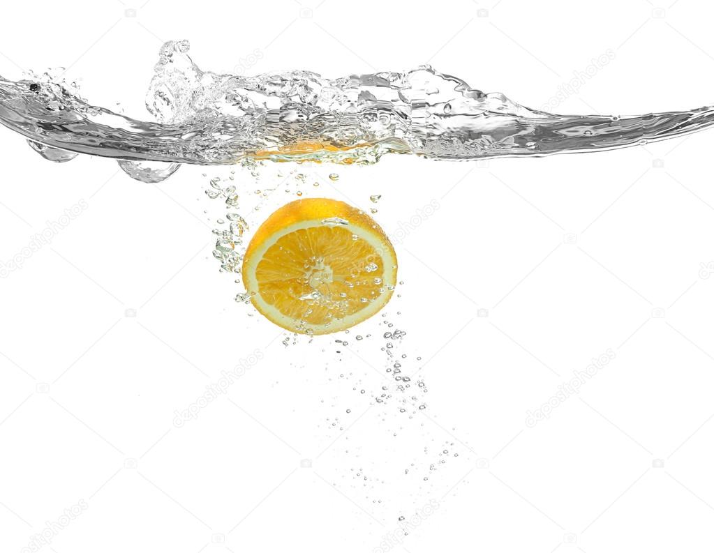 Lemon falling into water 