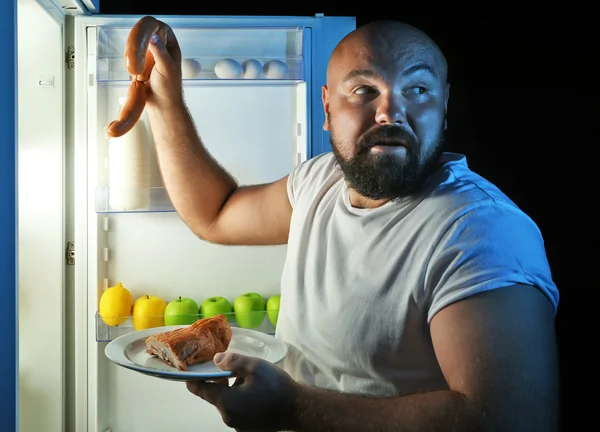 Homem tomando alimentos — Fotografia de Stock