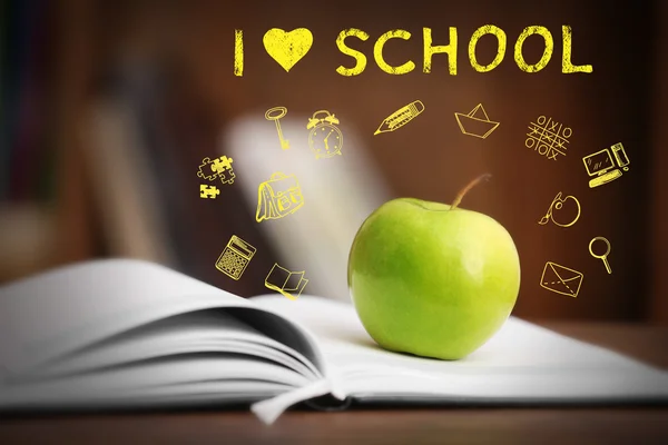 Boka med äpple och skolan ikoner — Stockfoto