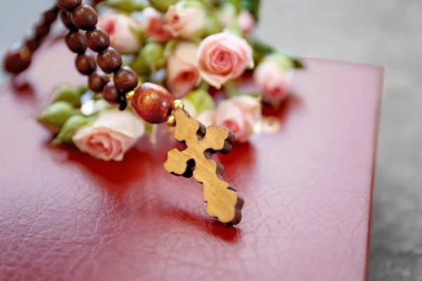 Wooden cross with flowers