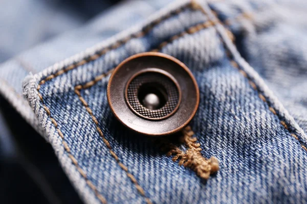 Button on a denim cloth — Stock fotografie