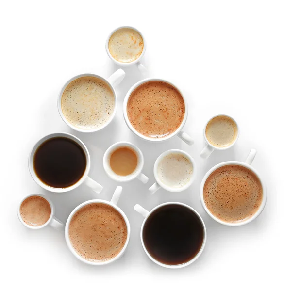 Kopjes koffie op witte achtergrond, bovenaanzicht — Stockfoto