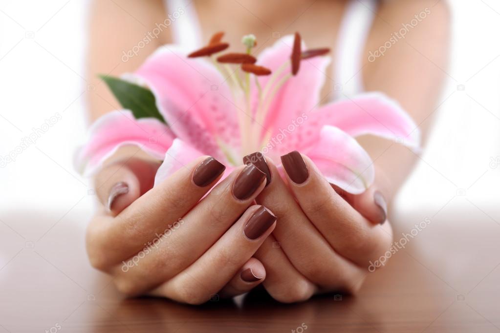 hands with brown manicure
