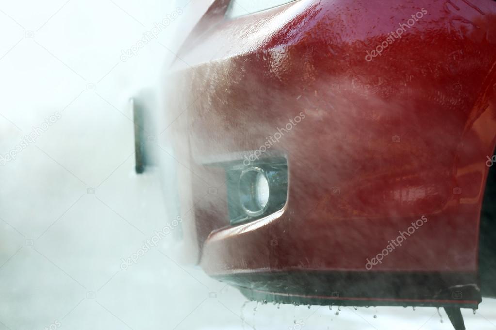 Cleaning car with high pressure water