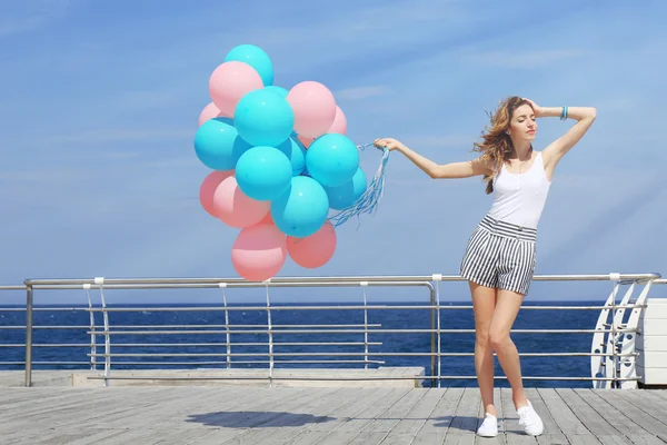 Woman with colorful balloons — Stock Photo, Image