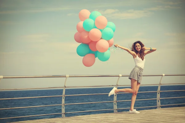 Woman with colorful balloons — Stock Photo, Image