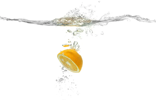 Lemon falling into water — Stock Photo, Image