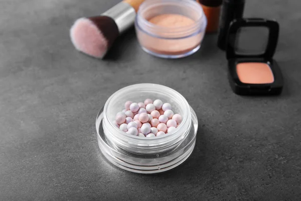 Cosmetic powder balls on grey background — Stock Photo, Image